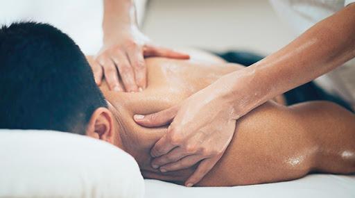 Sports massage. Physical therapist massaging shoulder region